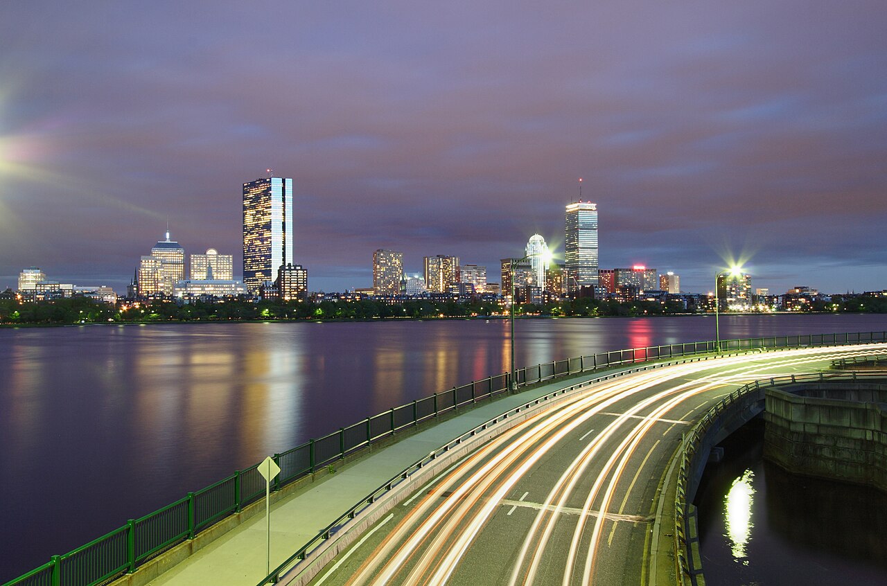 Charles River — View of Boston's Back Bay skyline, at night across the Charles River from Cambridge, just south of the Longfellow Bridge. The road in the fo