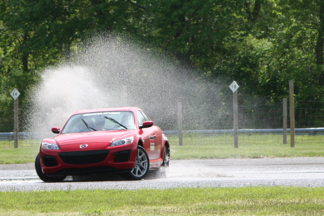 Skip Barber Racing School — Lime Rock — A Mazda RX8 in a Skip Barber Driving School on the Skidpad at Lime Rock Park